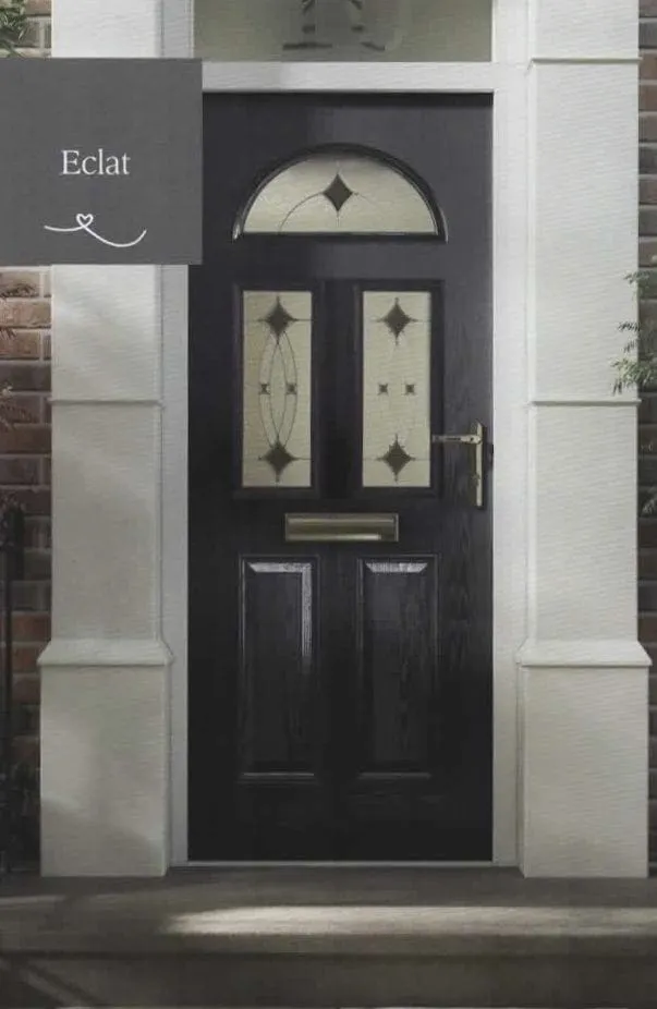 Black composite front door with an arched fanlight and decorative glass